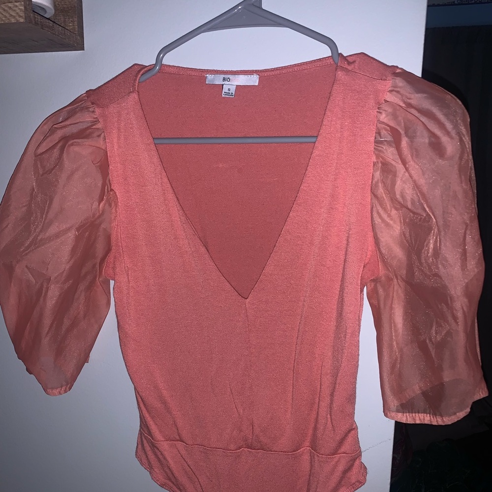 bubblegum pink colored body suit